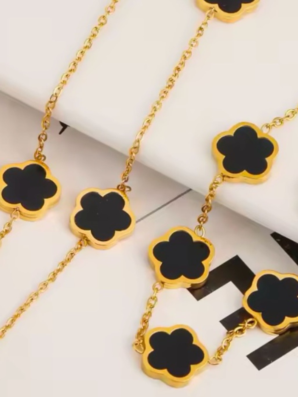 Gold Chain Necklace with Black Flower Motifs